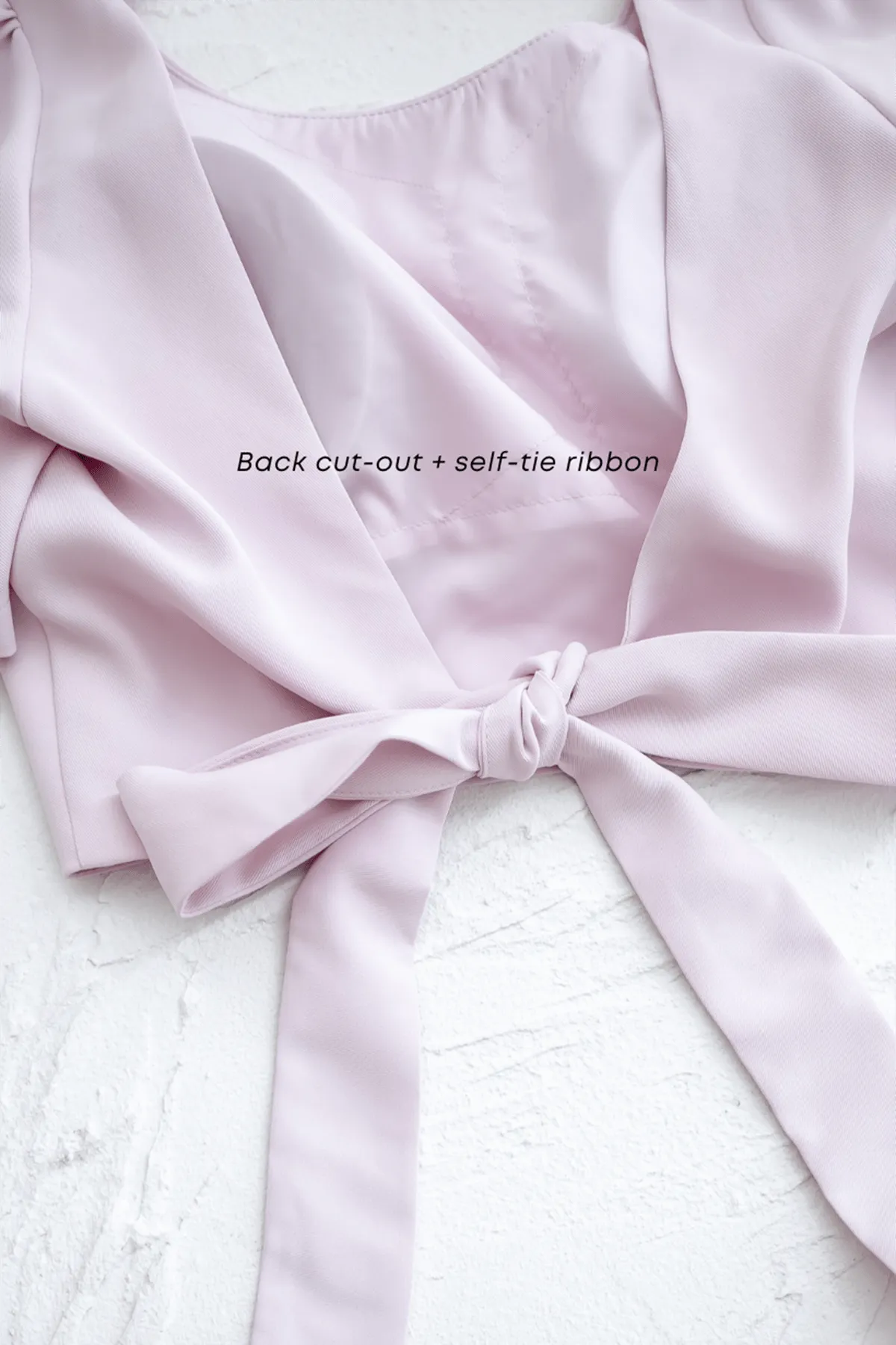 BEBE PADDED BOW OPEN BACK TOP IN OAT