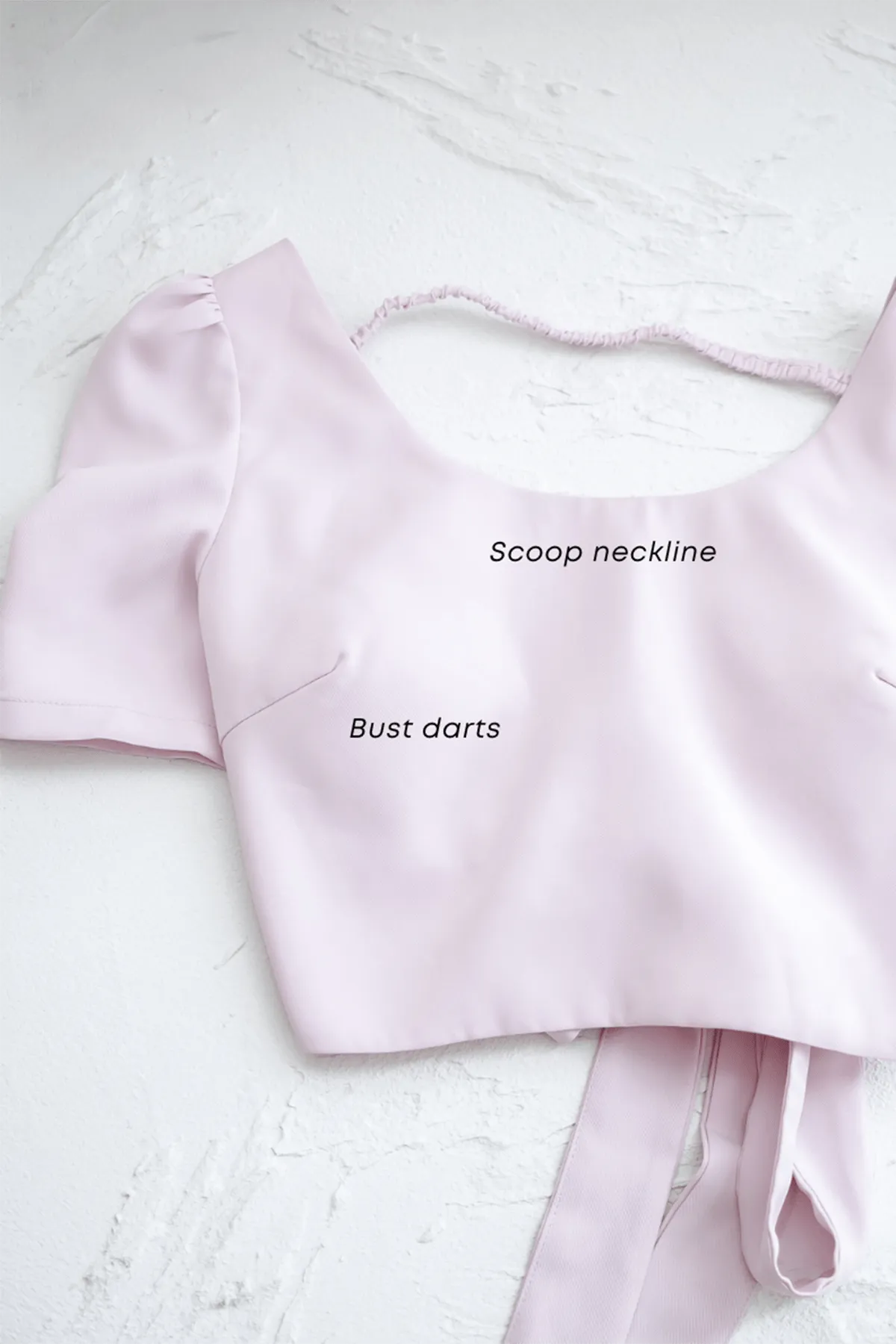 BEBE PADDED BOW OPEN BACK TOP IN OAT